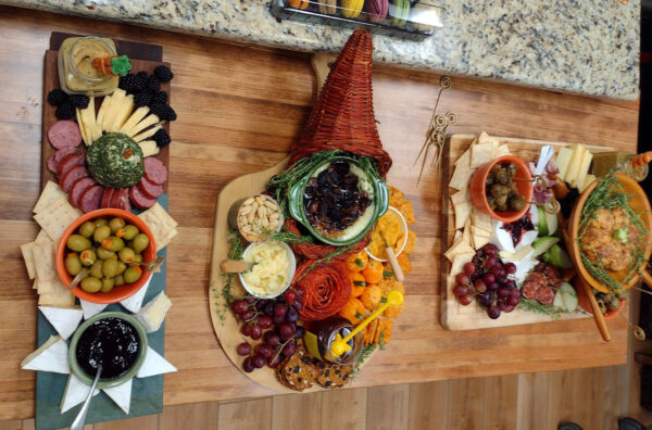 Charcuterie Boards with cheese, cold cut meats, olive oils, nuts, grapes and dips
